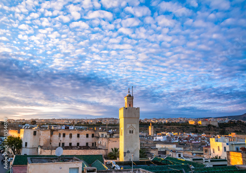 Amazing view of the old Medina in Fez ( Fes El Bali ) , Morocco at sunset. The ancient city and the oldest capital of Morocco, unesco world heritage site. Artistic picture. Beauty world