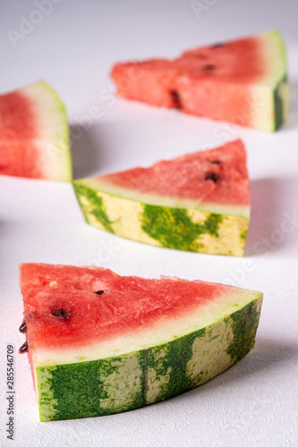 Watermelon slices on white background, pattern, texture, close up, selective focus