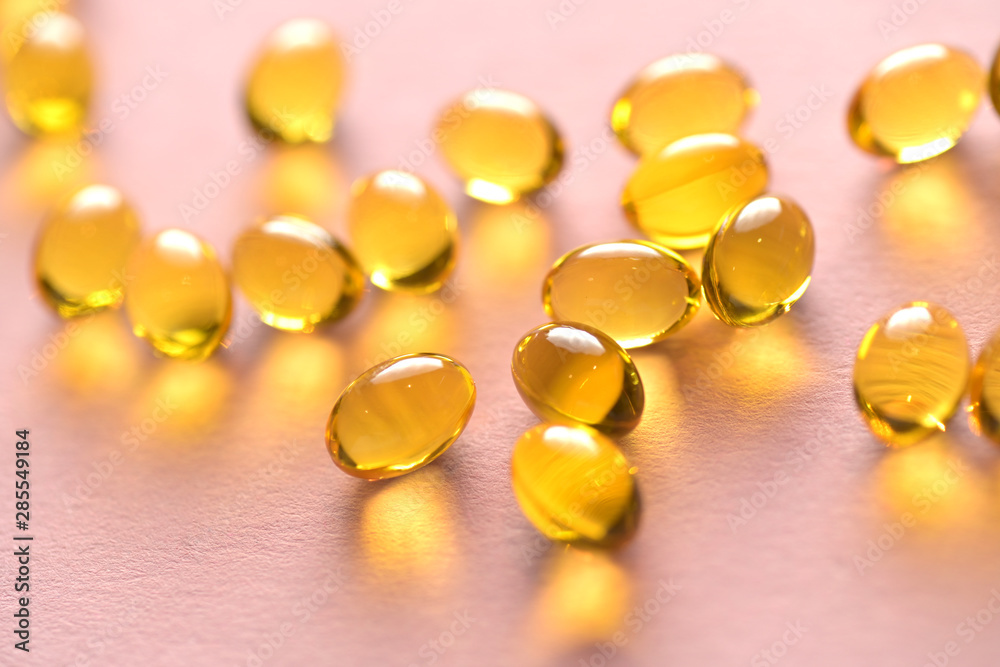 Close up capsules of fish fat oil in the heart shape, omega 3, Close up capsules of fish fat oil in the heart shape, omega 3,