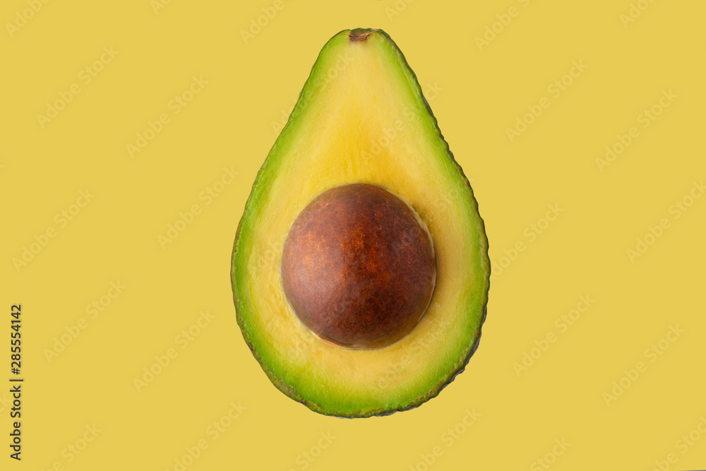 Avocado isolated on a yellow background, for design