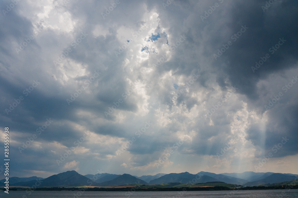Dark heavy cloudy sky over the Liptovska Mara lake, Slovakia