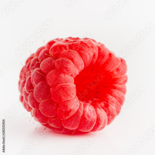 ripe juicy raspberries on a white background, Isolated closeup, for design