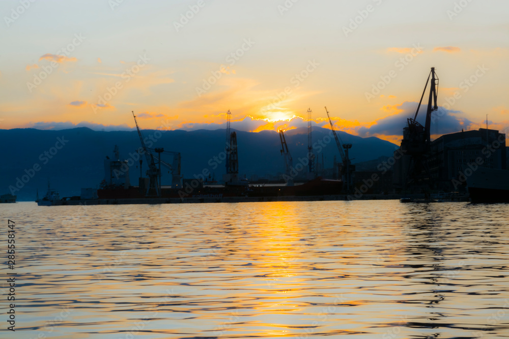 Naklejka premium Harbour of Rijeka in sunset in Croatia