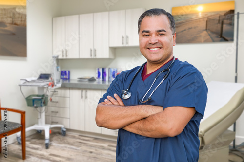 Hispanic Male Doctor Standi...