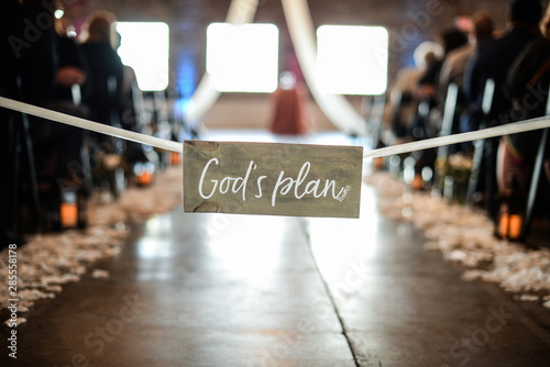 wedding aisle with religious sign