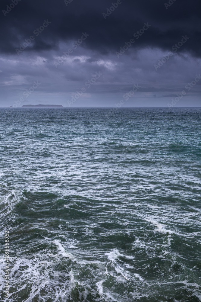 The ocean surface at the cloudy stormy day. Breathtaking romantic seascape. The ocean surface at the cloudy stormy day. Breathtaking romantic seascape.