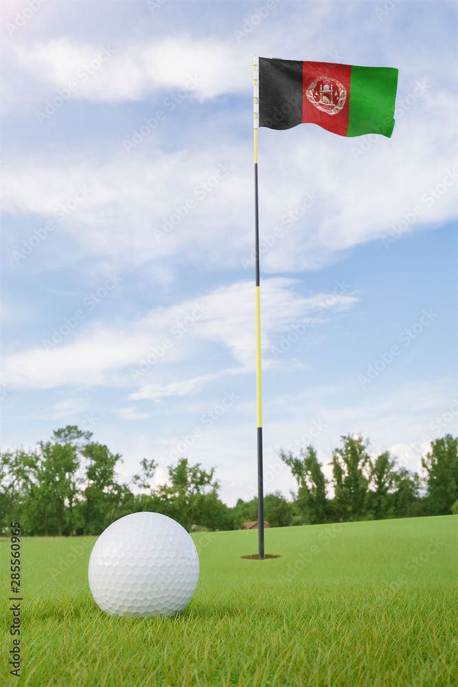 Obraz premium Afghanistan flag on golf course putting green with a ball near the hole