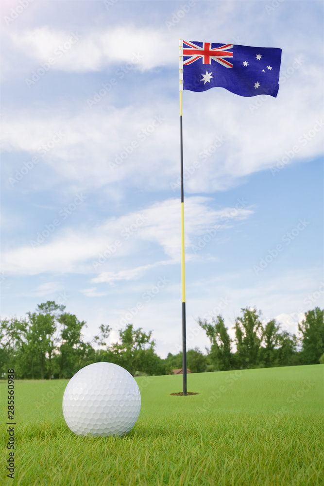 Obraz premium Australia flag on golf course putting green with a ball near the hole