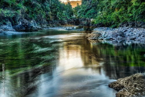 The beautiful Ruamahanga river flowing gently through New Zealand Native bush