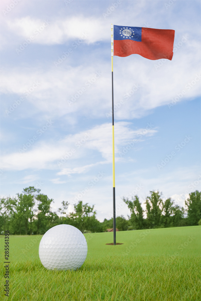 Obraz premium Myanmar flag on golf course putting green with a ball near the hole