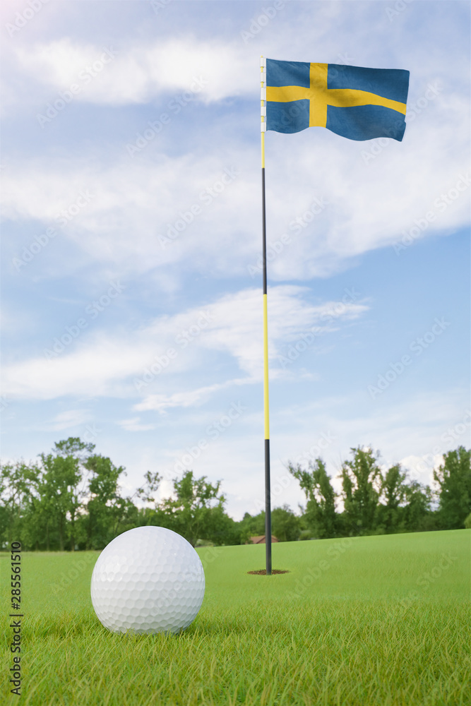 Obraz premium Sweden flag on golf course putting green with a ball near the hole