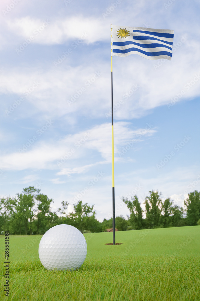 Obraz premium Uruguay flag on golf course putting green with a ball near the hole