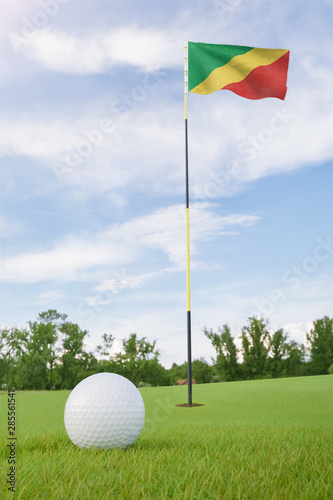 Republic of the Congo flag on golf course putting green with a ball near the hole