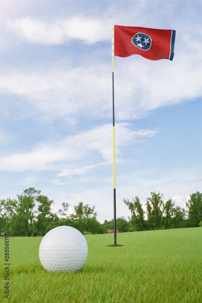 Obraz premium Tennessee flag on golf course putting green with a ball near the hole