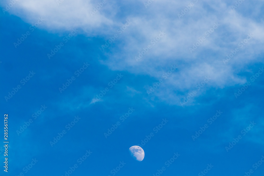 Cloudy blue sky with a nice clear moon Cloudy blue sky with a nice clear moon