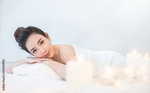 Closeup beautiful asian young woman lying down on massage beds at Asian luxury spa and wellness center. Portrait of beauty woman relaxing with copy space, healthcare lifestyle concept banner.