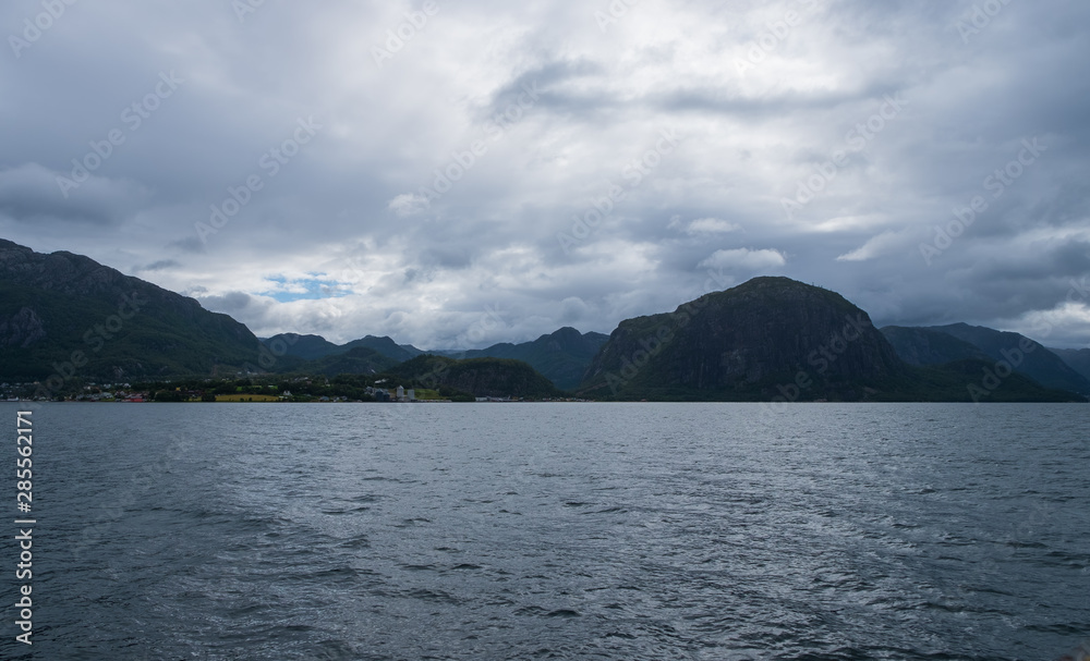 Sunny Norwegian landscape. View of the route of the Lauvvik - Oanes ferry in Norway. July 2019