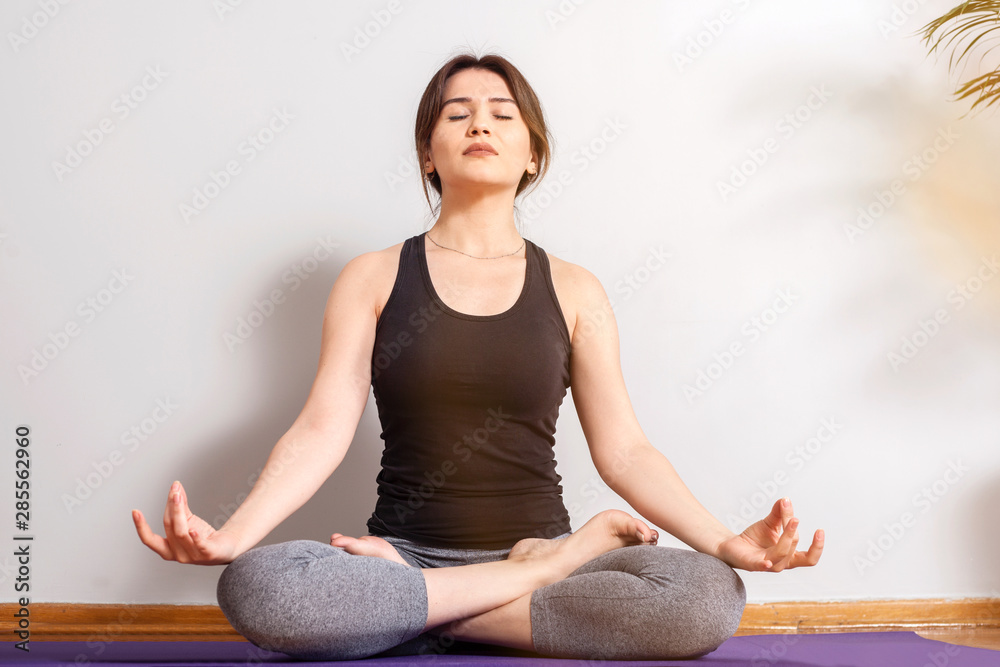 young woman doing yoga