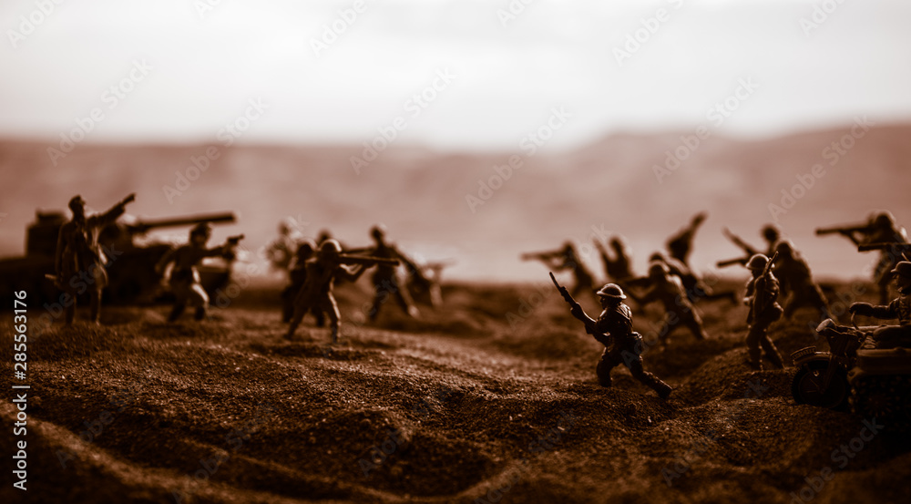 Fototapeta premium War Concept. Military silhouettes fighting scene on war fog sky background,