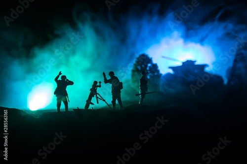 War Concept. Military silhouettes fighting scene on war fog sky background,