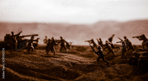 War Concept. Military silhouettes fighting scene on war fog sky background, © zef art