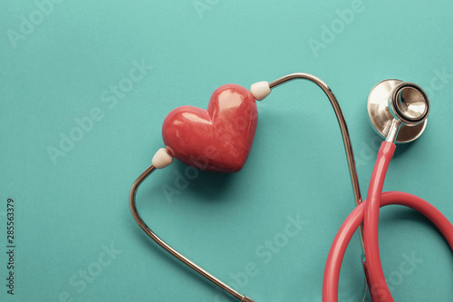 Fototapeta Naklejka Na Ścianę i Meble -  Red heart with stethoscope, heart health,  health insurance concept, World heart day, world health day