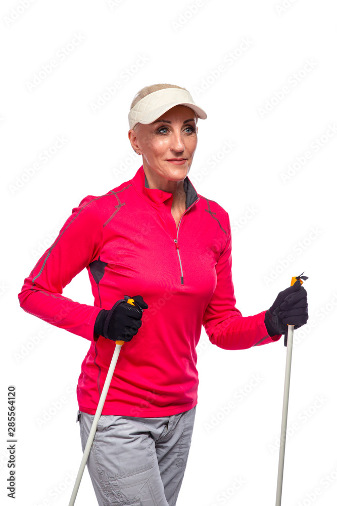 Smiling Senior Woman In Sport Outfit Posing With Nordic Walking Sticks Against White Background Smiling Senior Woman In Sport Outfit Posing With Nordic Walking Sticks Against White Background
