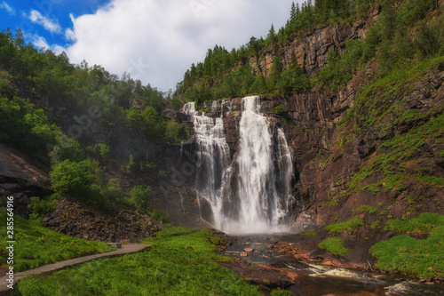 Frontal view of the Skjervsfossen in summer  seen from the base. Norway. July 2019