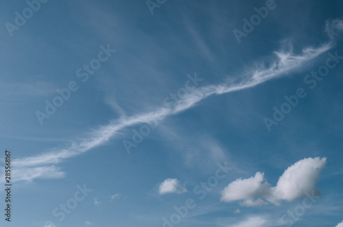 Fantastic soft white clouds on a blue sky background