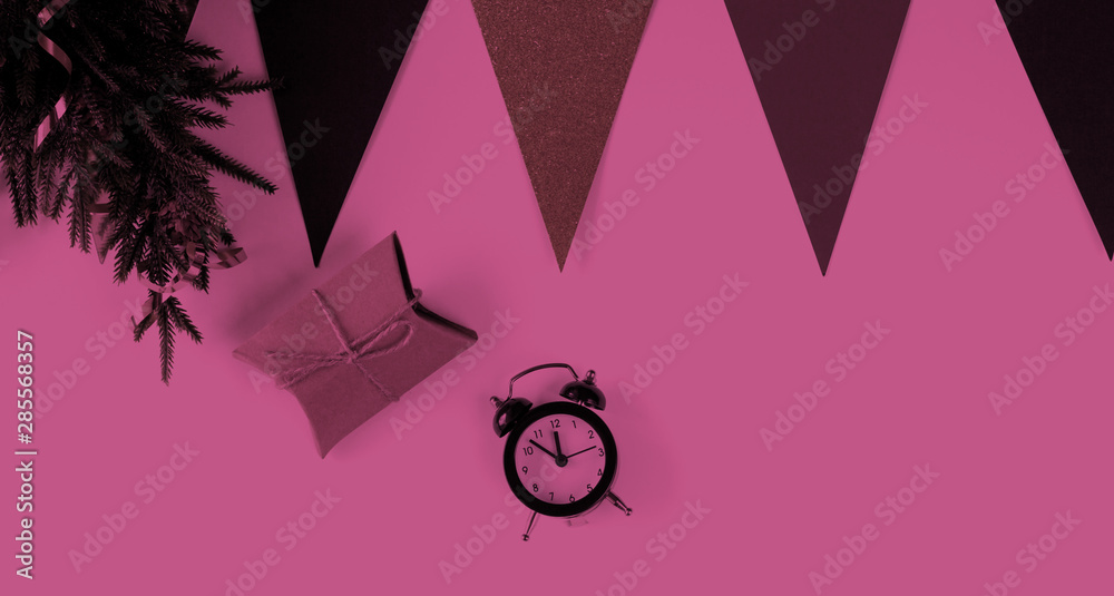 Christmas present and New Year holiday composition top view .Toned in Pink color with neon.Pink color trend concept. Christmas present and New Year holiday composition top view .Toned in Pink color with neon.Pink color trend concept.