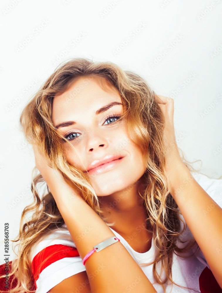 Obraz premium young pretty stylish hipster girl posing emotional isolated on white background happy smiling cool smile, lifestyle people concept