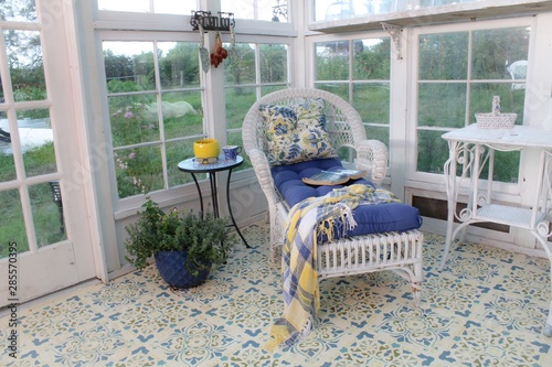 Fotografija Beautifully decorated interior of a greenhouse/summer house with stenciled floor
