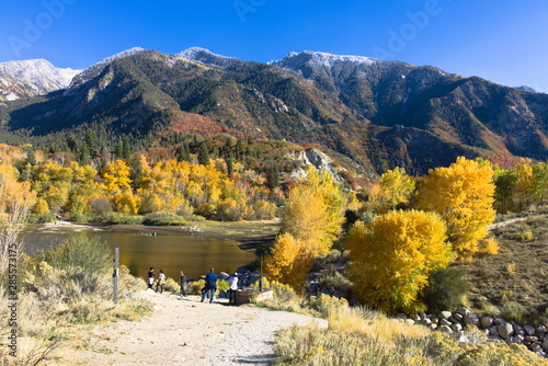 Hikers hang out in the fall at Bells Canyon Reservoir in the Wasatch Mountains of Utah photo