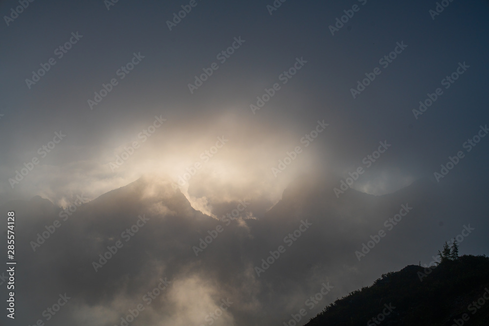clouds in the sky over mountains clouds in the sky over mountains