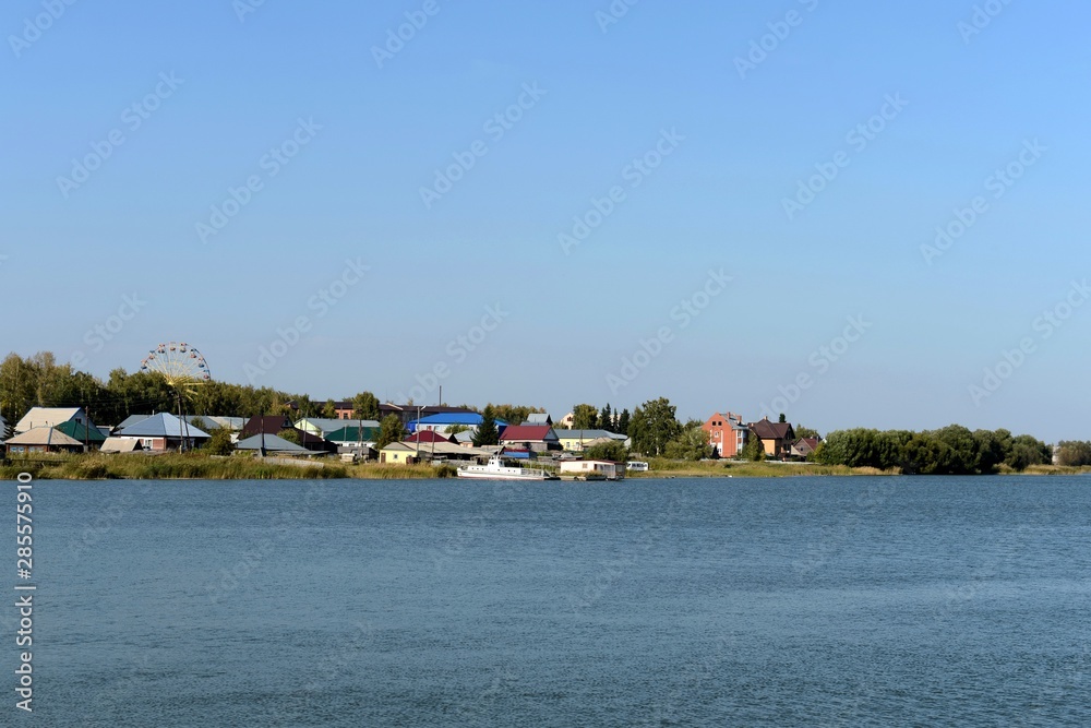 Mamontovo village on the shore of lake Big Island. Altai territory. Russia