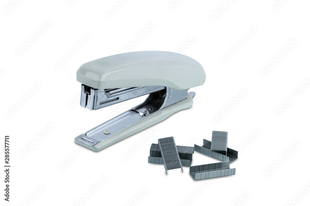 Office stationary Gray stapler with pile of staples isolated on white background Office stationary Gray stapler with pile of staples isolated on white background