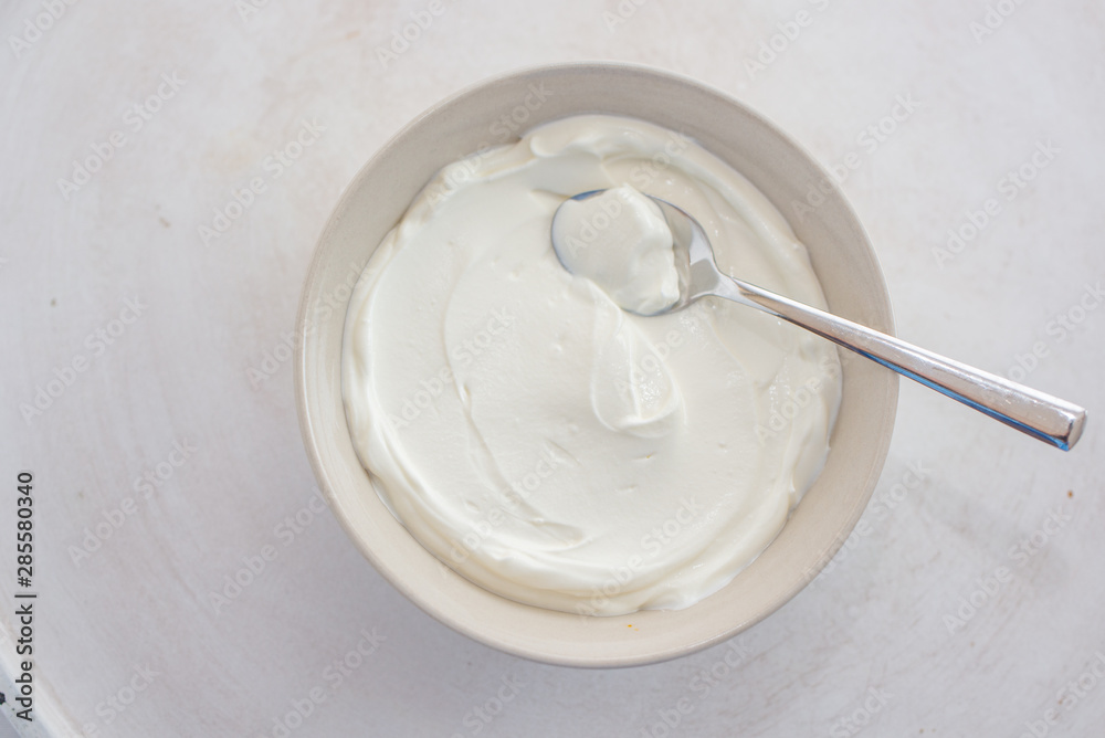 natural greek yogurt in cup on