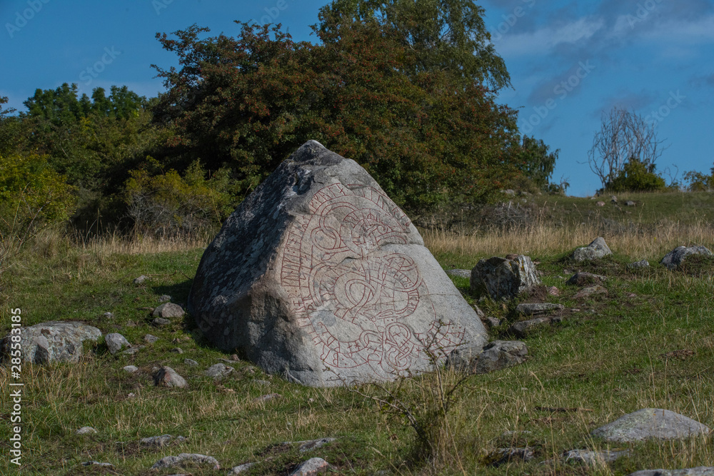 Rune stoone at viking burial mounds on the island Adelsö at the viking ...