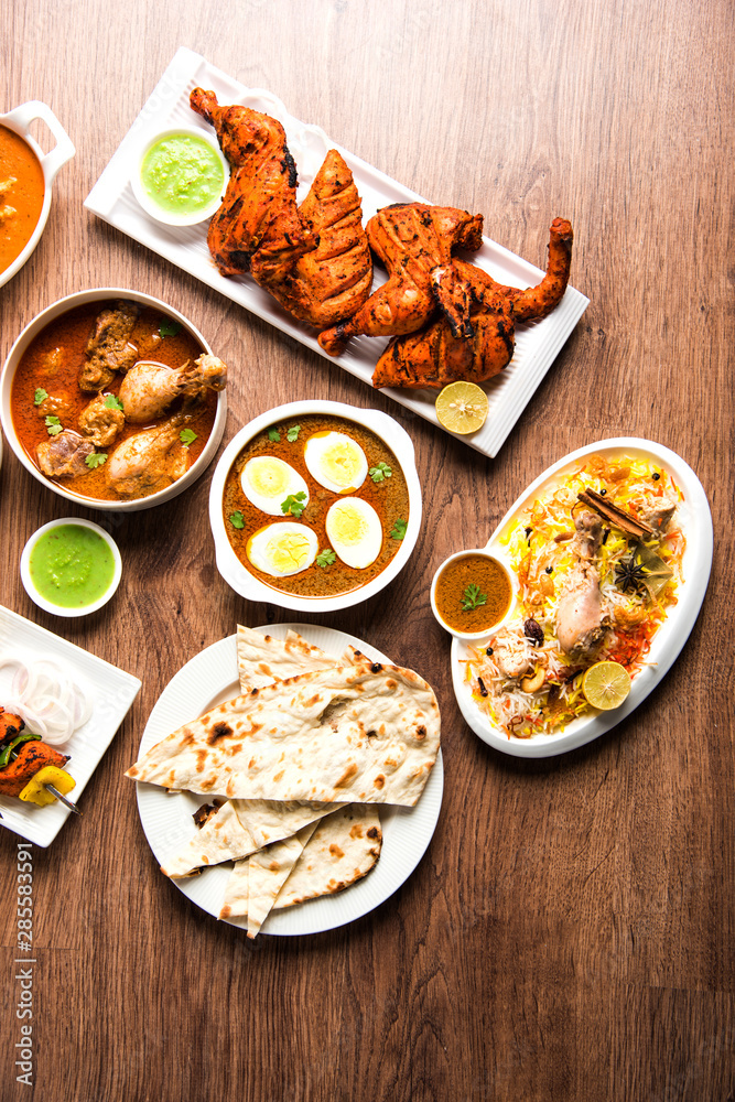 Assorted Indian Non Vegetarian food recipe served in a group. Includes Chicken Curry, Mutton Masala, Anda/egg curry, Butter chicken, biryani, tandoori murg, chicken-tikka and naan/roti
