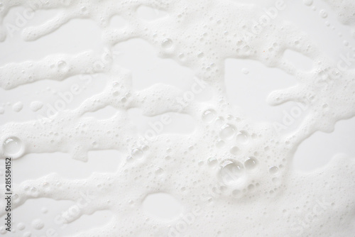 Abstract background white soapy foam texture. Shampoo foam with bubbles