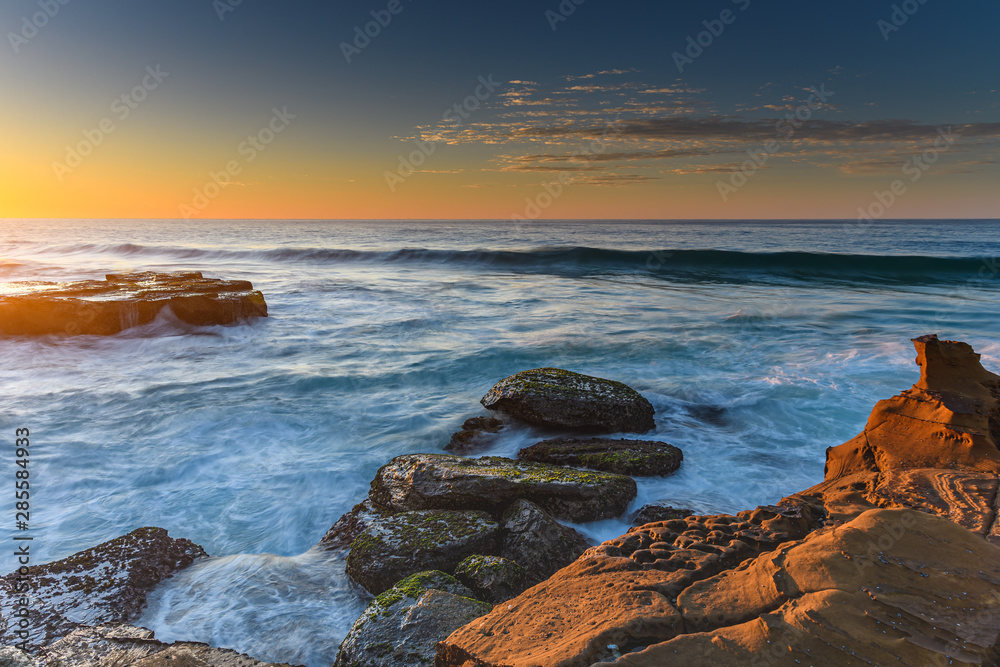 Clear Skies and Rocky Coastal Sunrise Clear Skies and Rocky Coastal Sunrise