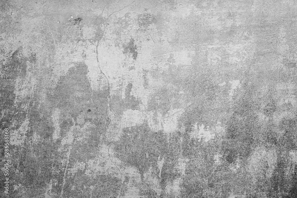 Texture of a concrete wall with cracks and scratches which can be used as a background