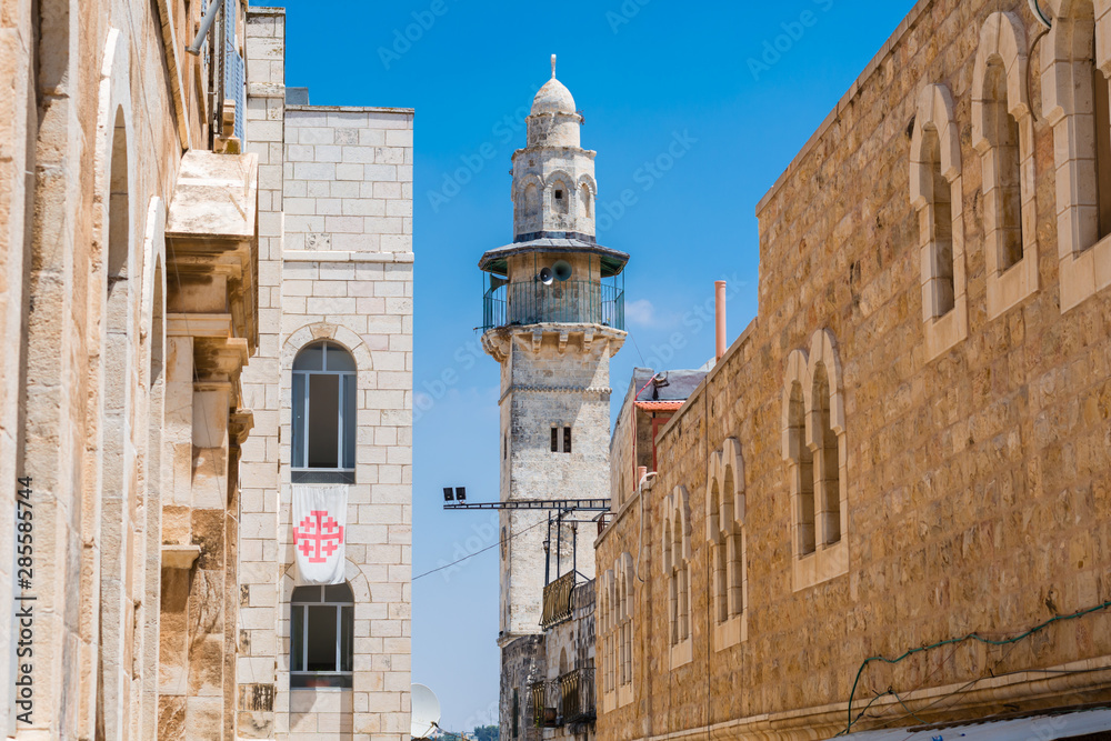 View on Minaret from the narrow stone street in Old City Jerusalem