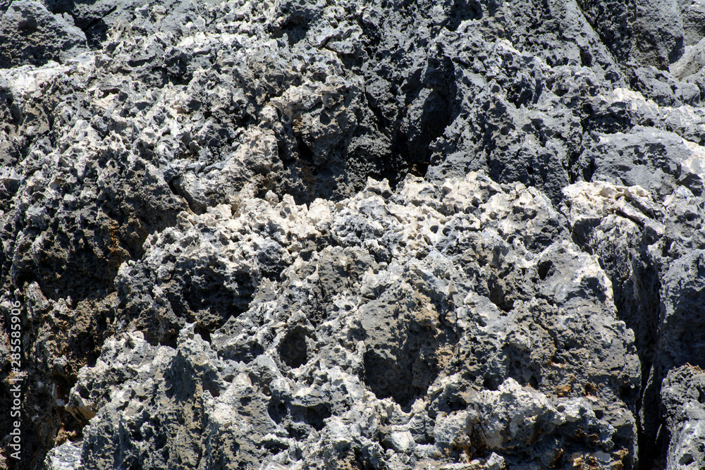 Mediterranean Sea. Coastal cliffs with stone structure with traces of time. Concept - time frozen in stone Mediterranean Sea. Coastal cliffs with stone structure with traces of time. Concept - time frozen in stone