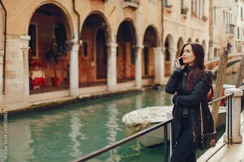 girl talking on the phone and taking pictures in Venice Italy © prostooleh
