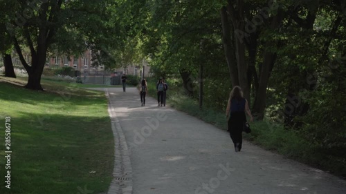 Wallpaper Mural SLOW: People walking in the park Torontodigital.ca
