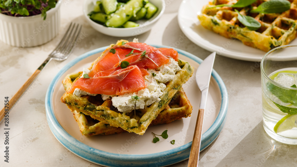 Belgian waffles with cheese and salmon. Healthy breakfast with ricotta and fish Belgian waffles with cheese and salmon. Healthy breakfast with ricotta and fish