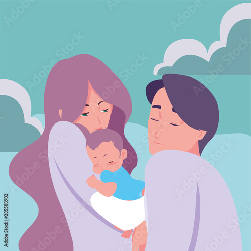 mom and dad carrying her newborn