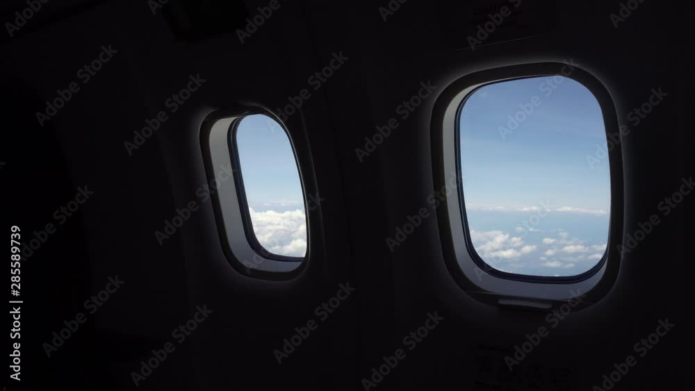 Looking through the Airplane Window .Clouds in the aircraft's porthole. Looking through the Airplane Window .Clouds in the aircraft's porthole.