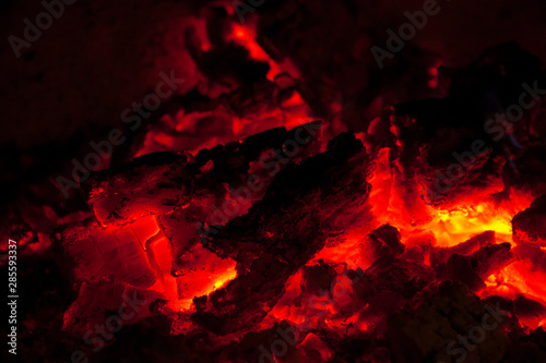 Nature fire flames on black background. Fire burning firewood burning fire flame texture in the fireplace charcoal. Concepts: fire, BBQ. barbeque, still life